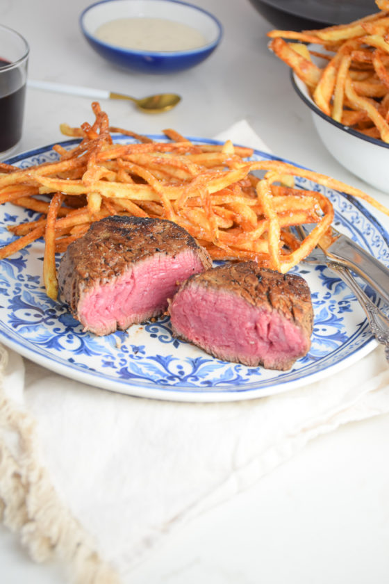 Steak Frites on a blue and white plate