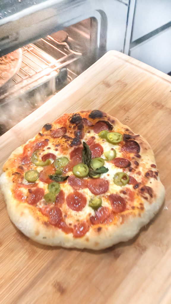 Cooked pepperoni and jalapeno pizza