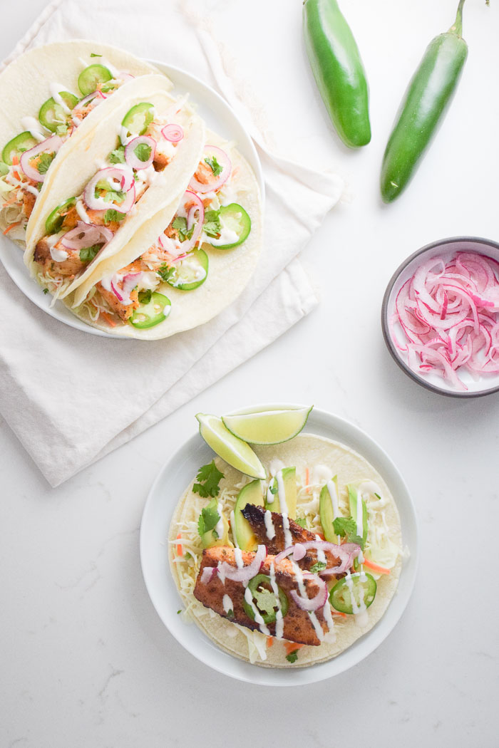 Spicy Fish Tacos with hot sauce crema