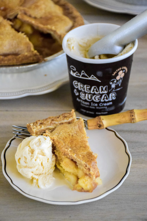 Pie and Ice Cream on a light colored wood table